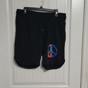 Stylish Black Athletic Shorts with Vibrant Peace Design